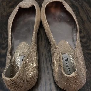 Gold glittery flats.